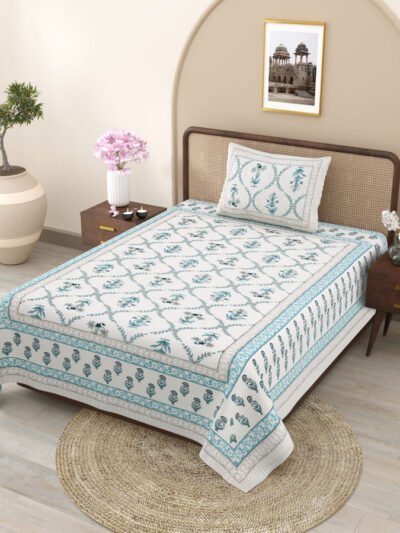 side angle of bed - with single jaipuri bedsheet on the bed
