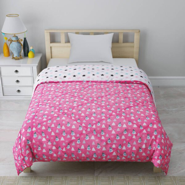 comforter for kids, a pink comforter with small snowman prints on side and white stars on the reverse side.