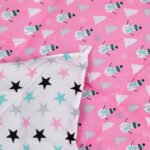 a reversible comforter with pink snowman print on one side and white on other side.