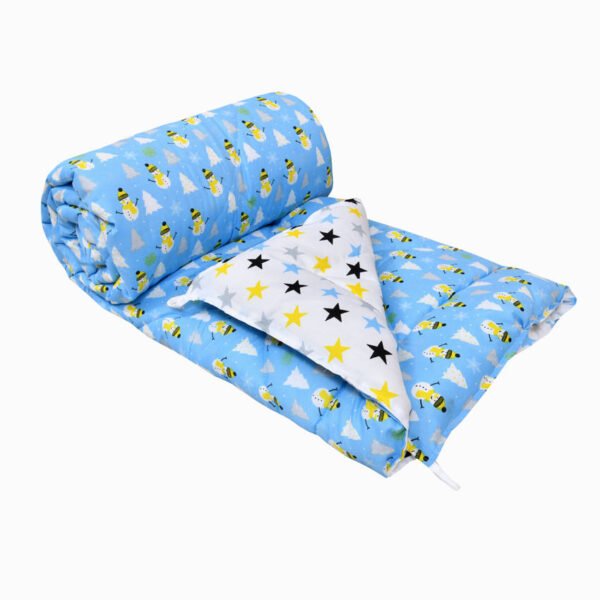 a reversible comforter with blue color, and white snowman print on one side and white color on the other side with star print