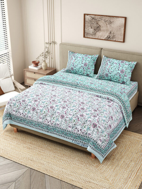 Quilt bedding set with bedsheet annd razai - one bedsheet with 2 pillow covers and 1 quilt in pink color in sky blue and white reversible pattern