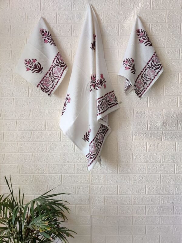 Hand and bath towel set of 3, featuring white towels adorned with pink flowers.