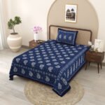 single blue and white bedsheet with an elegant floral pattern - side view