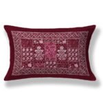 Red and white floral-patterned pillow