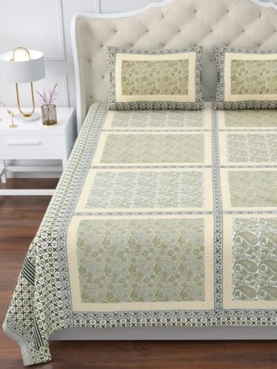 A king size mustard and white bedspread with a beautiful floral pattern, spread nicely on bed.