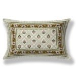 a green and white pillow features a lovely floral design