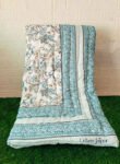 front and back design of jaipuri razai - blue color, and floral print
