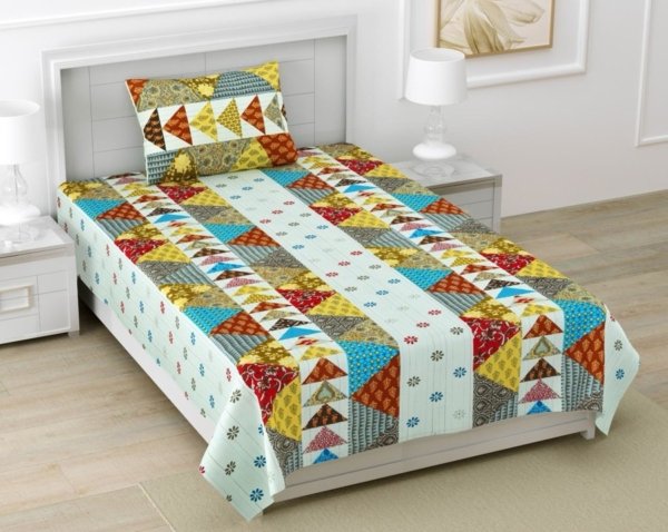 Light blue single bed sheet with a Barmeri patchwork design featuring geometric shapes and elephant motifs in various colors. The bed sheet has end-to-end stitching.