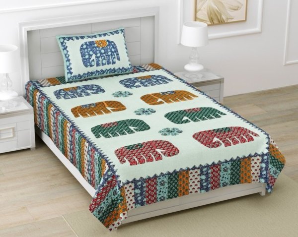 Single bedsheet made from 100% cotton with a light blue base and a patchwork of colorful geometric Barmeri prints and playful elephant designs