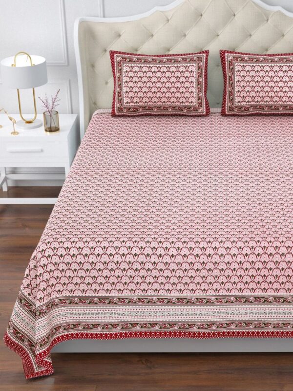 Add a splash of charm to your bedroom with this beautifully designed pink and red floral bedsheet set. Featuring traditional block print patterns inspired by Indian heritage art, this set brings together elegance and coziness effortlessly. The vibrant red border provides a striking contrast to the delicate pink base, creating a balanced and inviting look. Made from premium 100% cotton, this Super King-size bedsheet is soft, breathable, and perfect for all-season comfort.